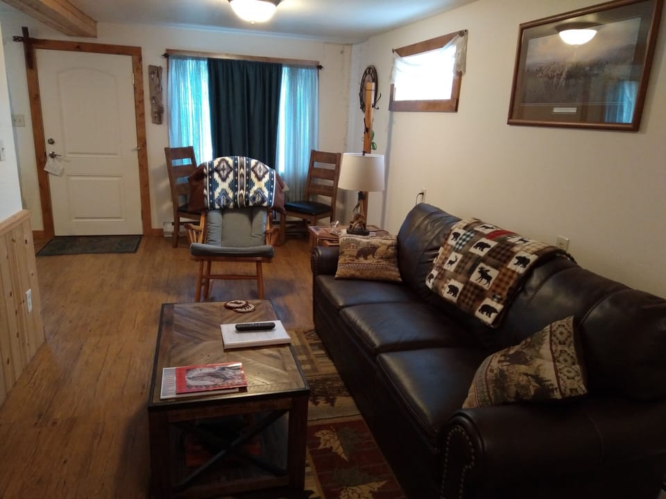 Living Room: Rocker, Couch, End Table and Lamp, Coffee Table. 