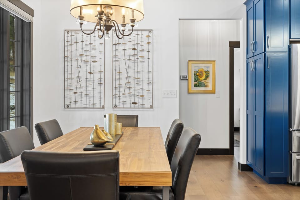 View of the dining room with the kitchen near by