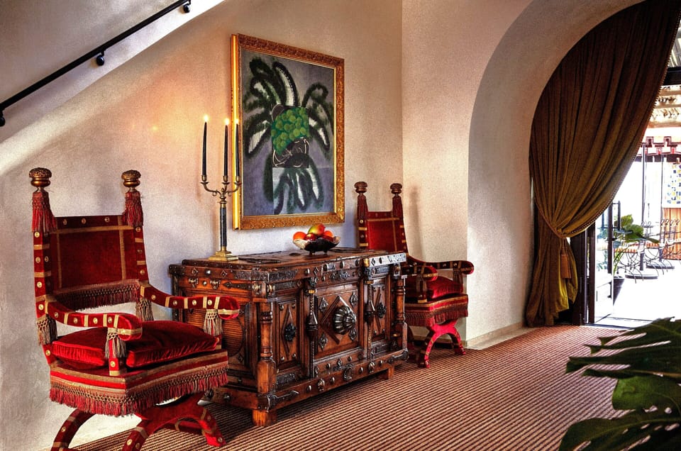 Unwind in a richly styled lounge beside breezy terrace doors.
