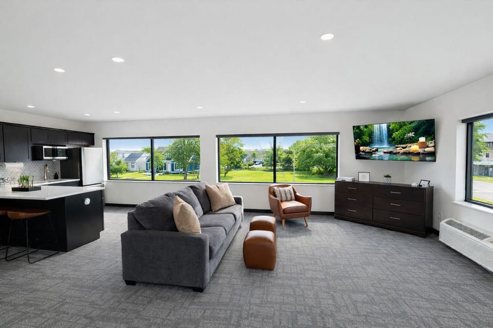 Bright, open, and inviting—this spacious living area is perfect for gathering, laughing, and making memories. Natural light fills the room while modern comforts and calming views make it easy to settle in and stay