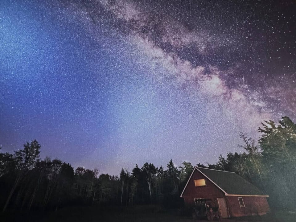 Milky Way sky over cabin