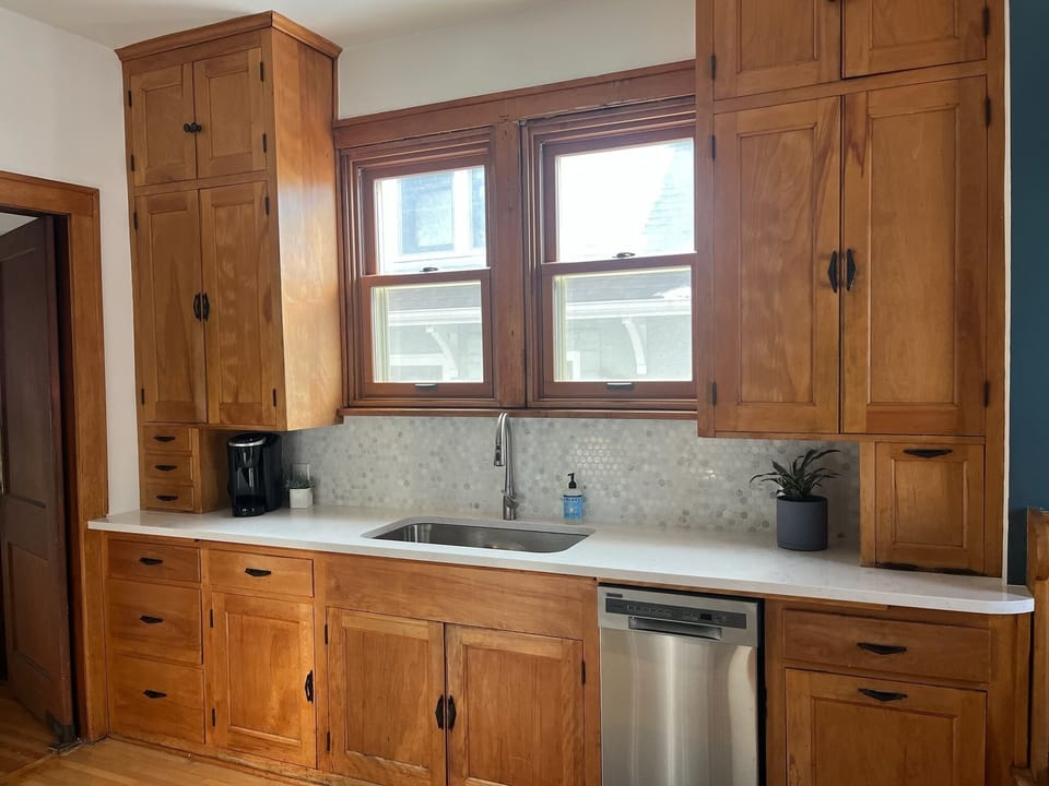 Kitchen- new quartz countertop, new sink and appliances.