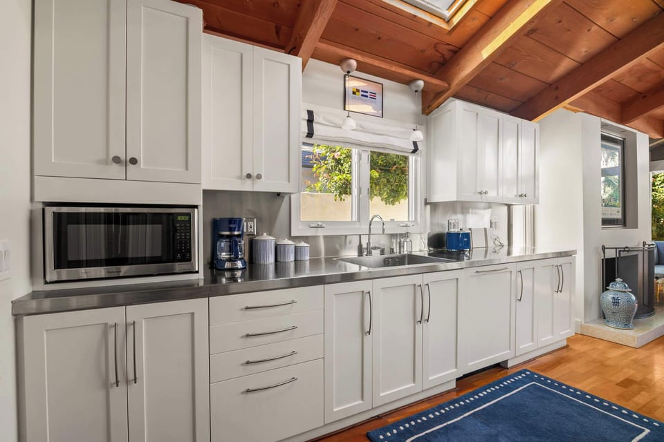 The well-equipped kitchen with stainless appliances and plenty of space for meal prep 