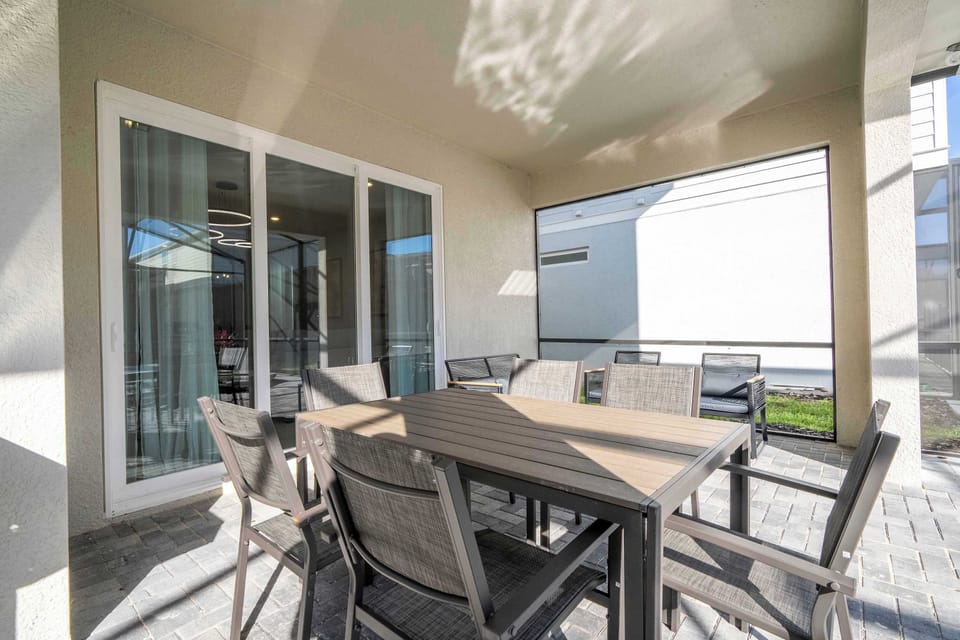 Savor al fresco meals poolside with plenty of seating for the whole group.