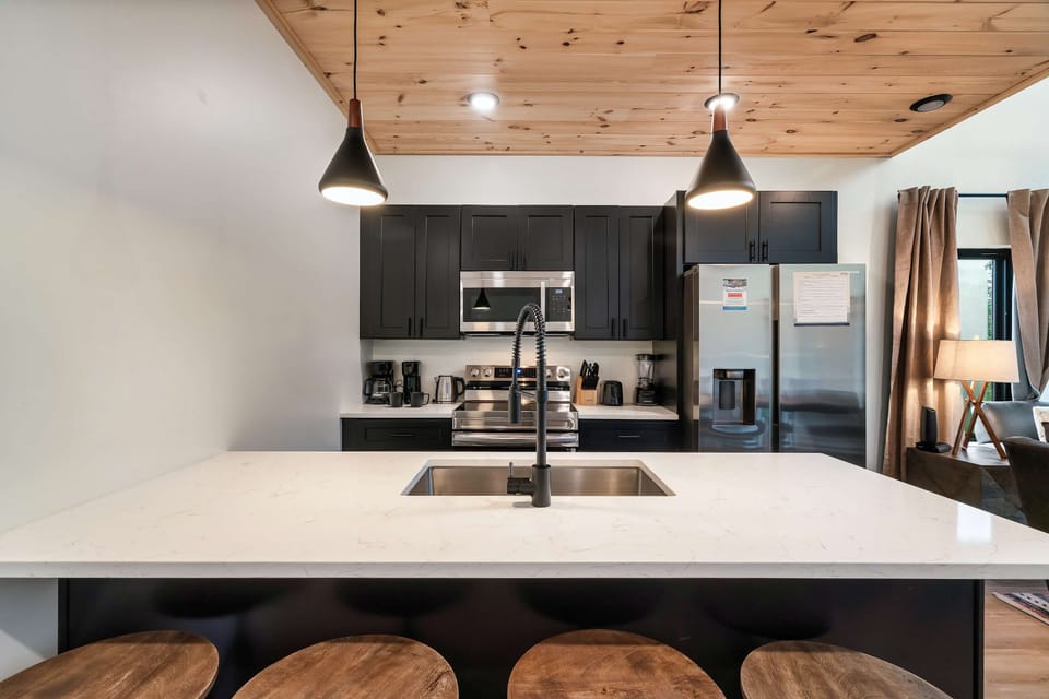 Homey Kitchen with a sleek design and a spacious island, perfect for culinary adventures and gatherings!