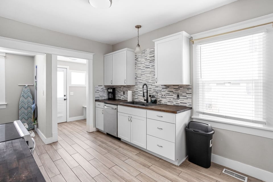 Step into your modern kitchen, with plenty counter space and supplies to cook your next meal!
