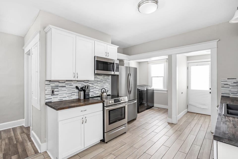 Step into your modern kitchen, with plenty counter space and supplies to cook your next meal!