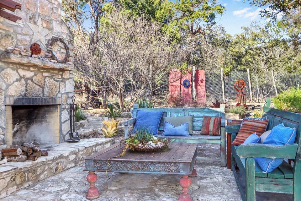 The outdoor grounds have a fireplace and seating area