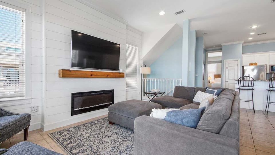 Living area with TV and balcony access- 2nd floor