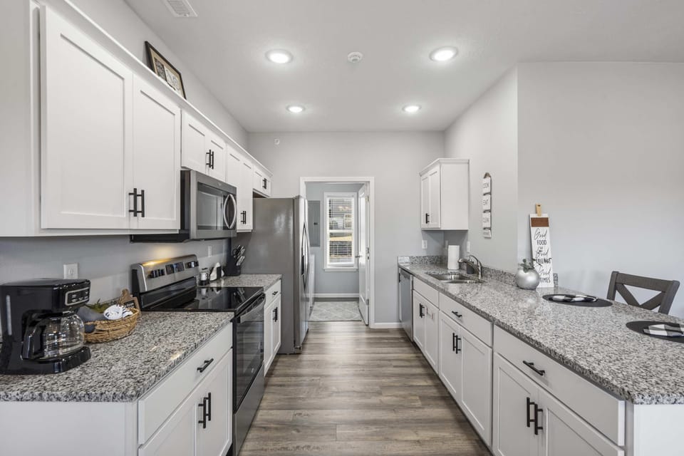 The open, airy kitchen offers ample space & every home comfort