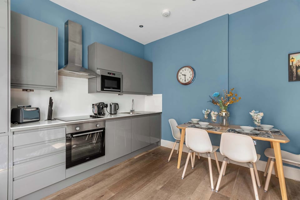 Sleek kitchen with dining space and modern finishes