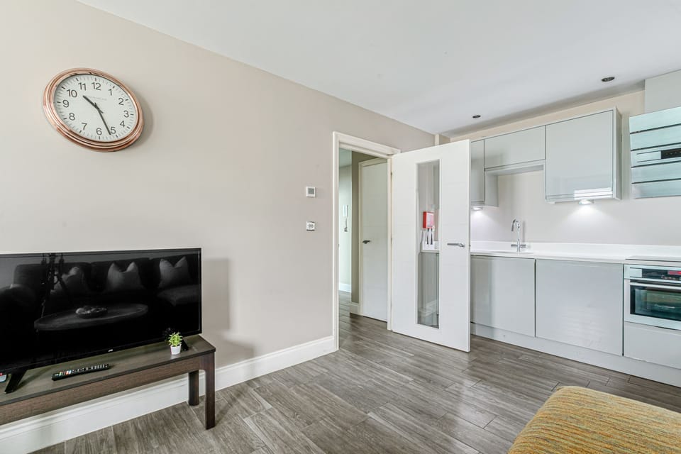 The modern smart TV is set up so you can see it from every angle of the open-plan living area.