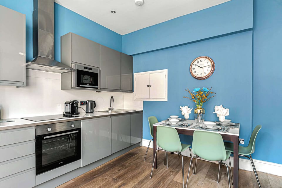 Sleek kitchen with dining space and modern finishes