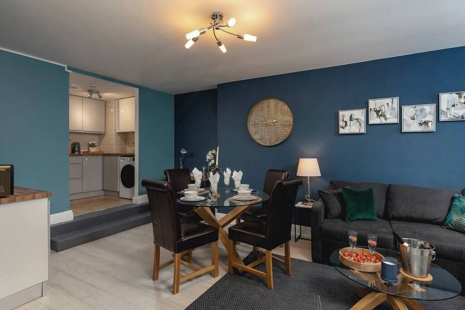 Chic living room with gold wall art and cozy seating