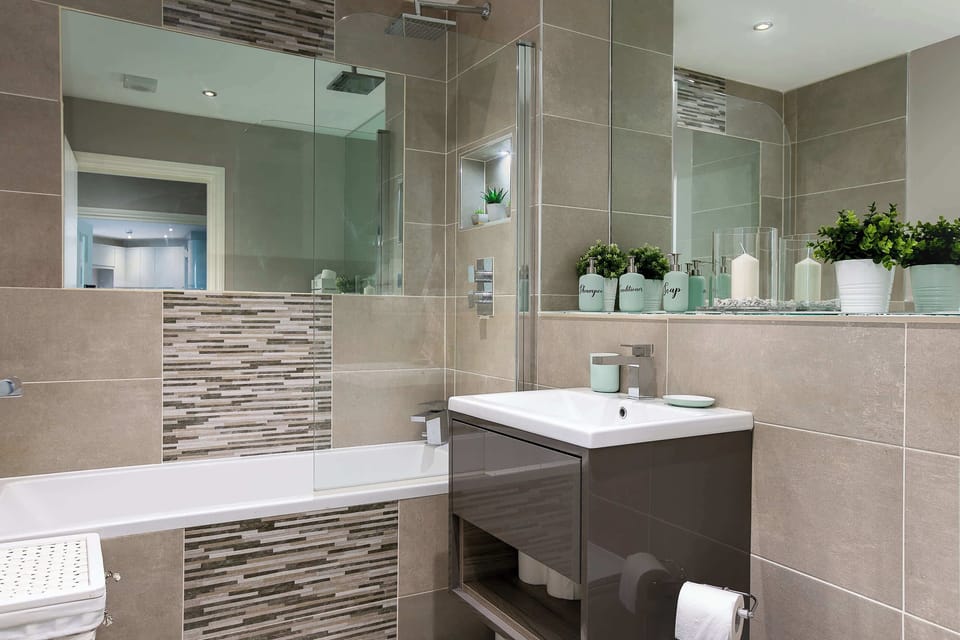 Soak in the tub or freshen up with a shower—this clean, modern bathroom has everything you need.