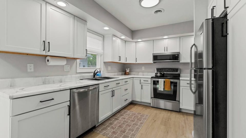 Cook with ease in this well equipped kitchen complete with stainless steel appliances, an electric stove and all the essentials you need. 