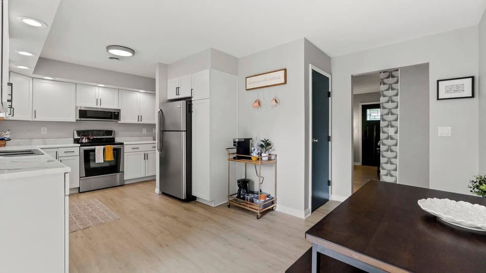 Dining area off of kitchen. Coffee cart with kurig and drip coffee available. 
