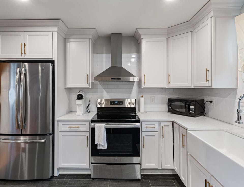 The open, airy kitchen offers ample space & every home comfort