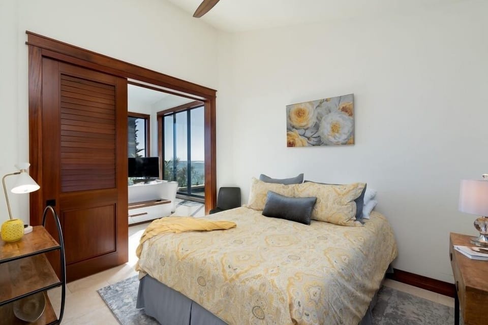 2nd floor suite with a queen-size bed and ac.