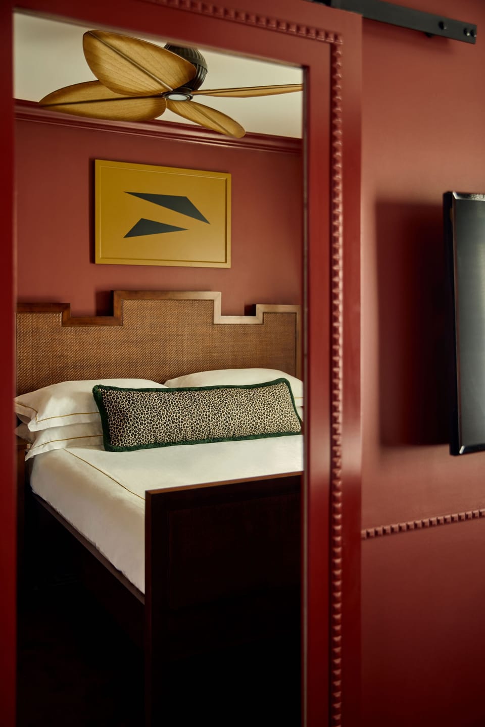 Feel pampered in a designer room with stylish, reflective details.