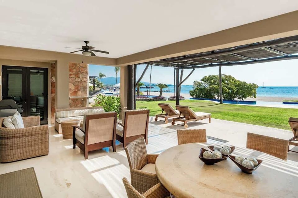 Fall in love with our spacious ocean-view terrace—just steps from the beach, where every sunset feels like a private romance
