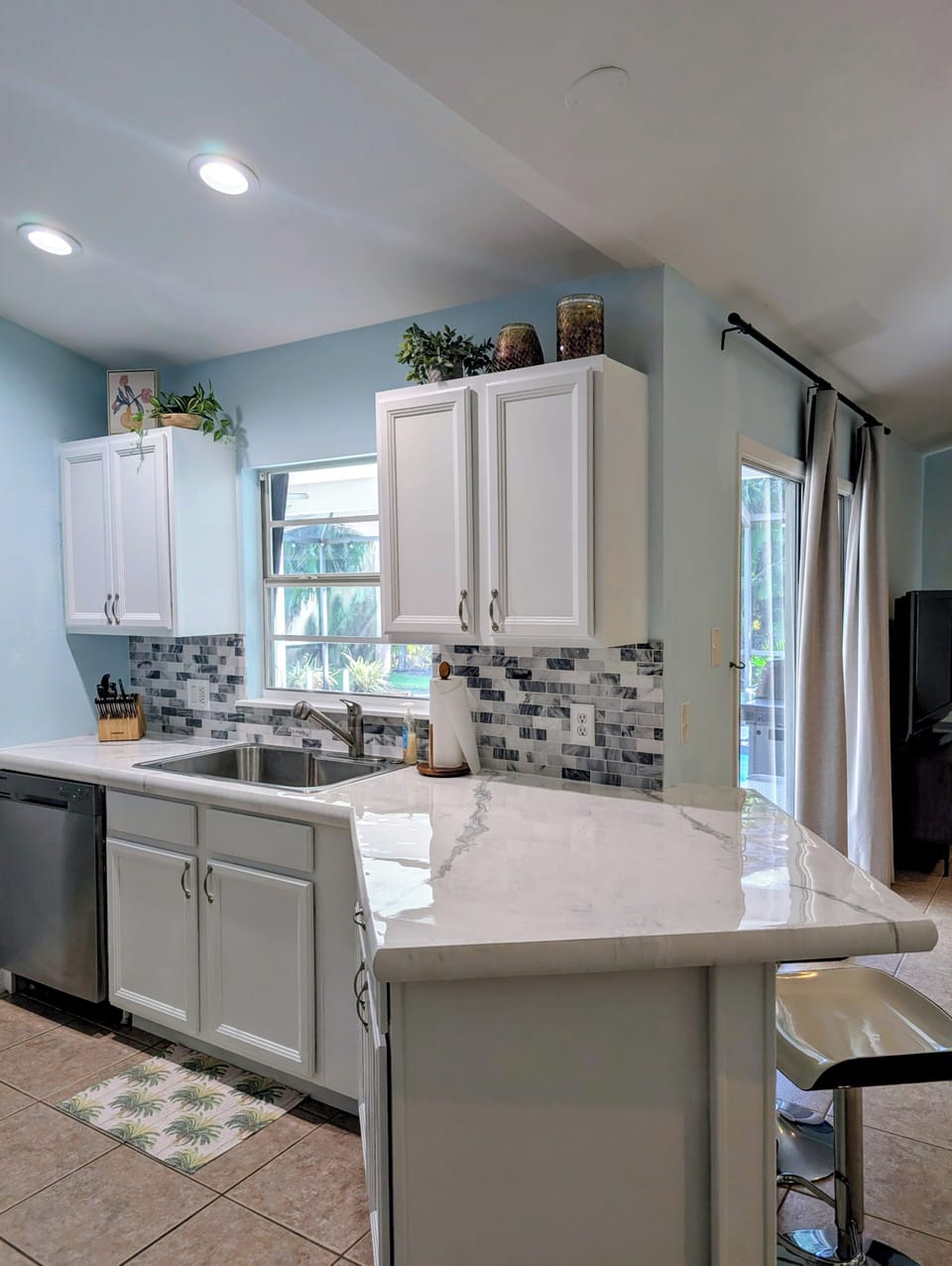 dishwasher, large sink with garbage disposal, tasteful decor, beautiful counters