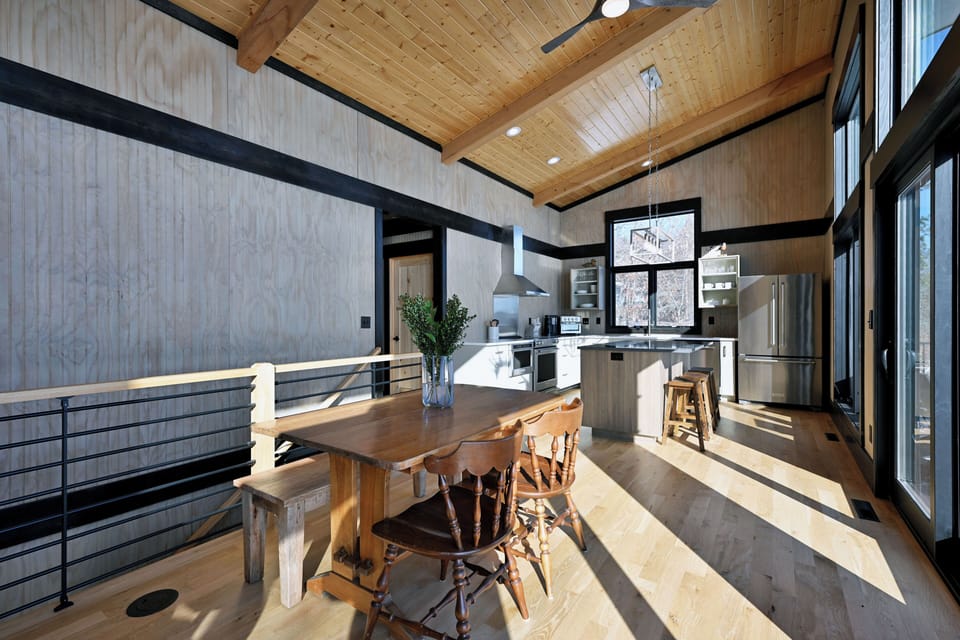 Dining room, eat-in kitchen and staircase to lower level