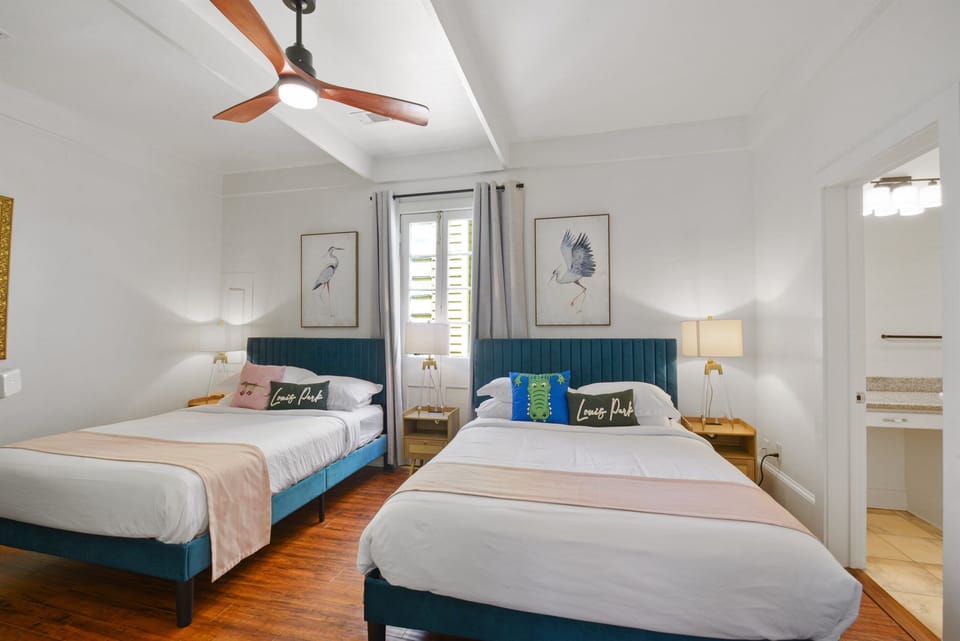 Bedroom #2 - Spacious bedroom with two queen beds, top-rated linens, and historic details