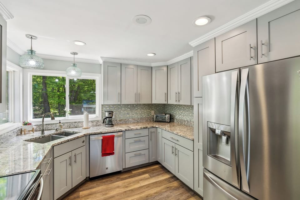 Fully equipped kitchen with pots, pans, dishes, silverware, glassware and more. 