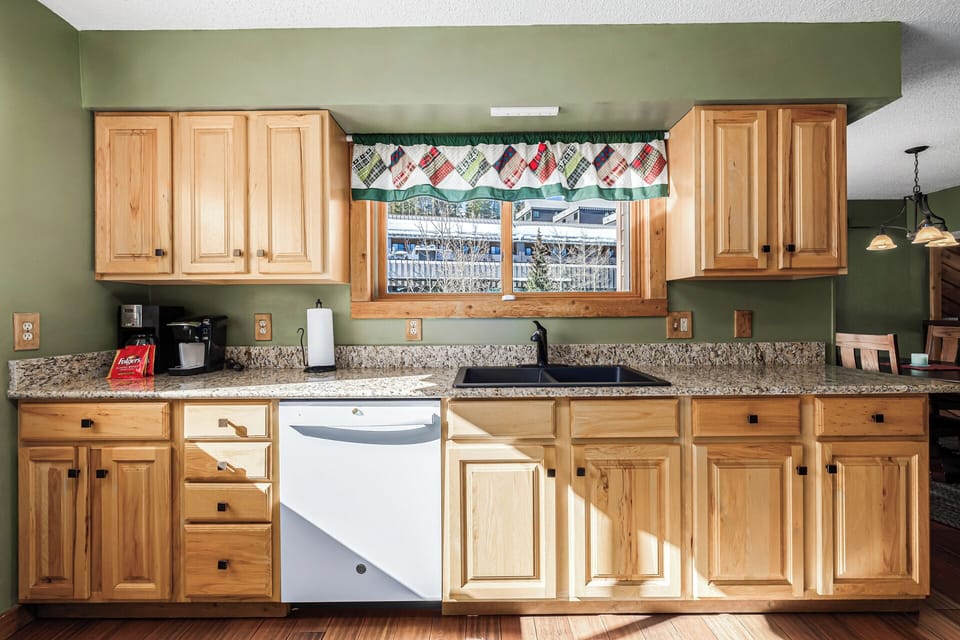 Granite countertop kitchen with scenic window view