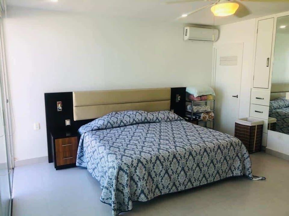 A cozy king bed with bedside tables