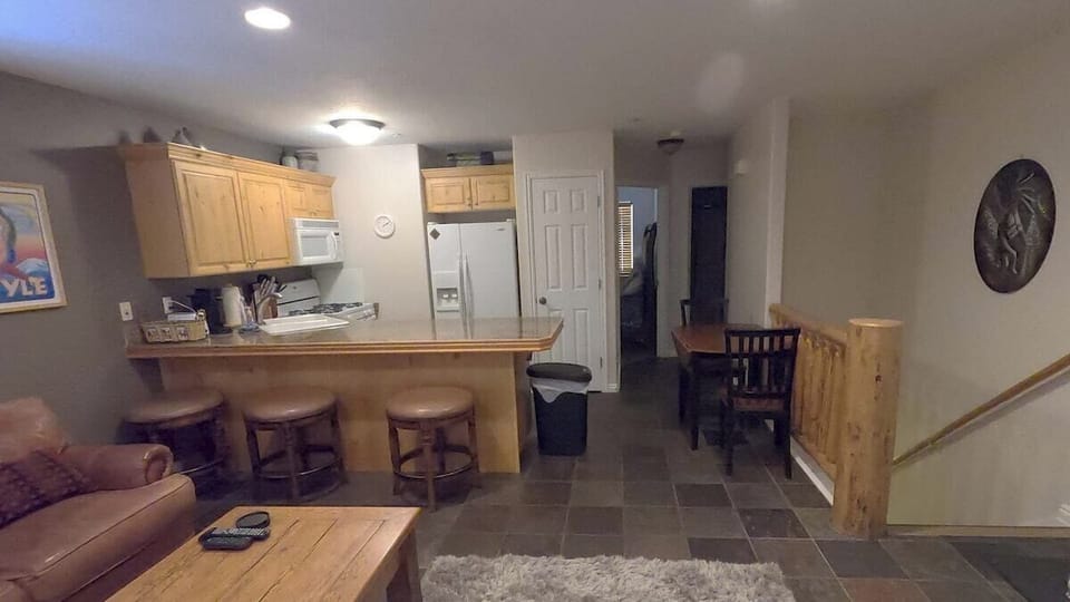 Main level open floor living room, kitchen and small dinning area. Kitchen full stocked with cooking utensils, Keurig, dishwasher, microwave and more
