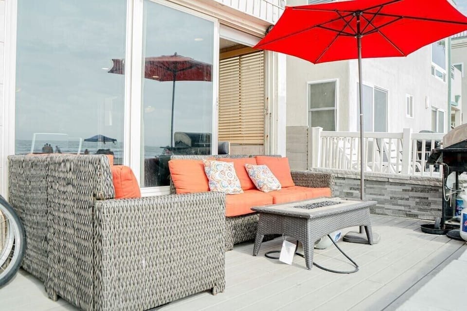 Patio lounge is ocean front above boardwalk. Couches, fire table, umbrella, bbq.