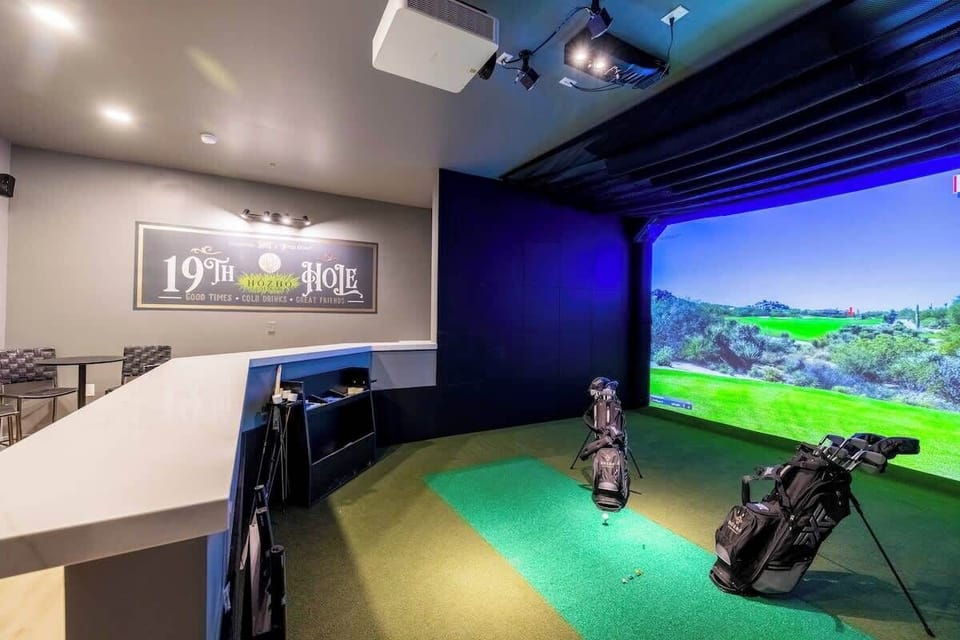 Practice anytime in this pro golf simulator and lounge with immersive views