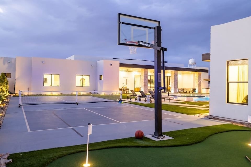 Shoot hoops, play pickleball, or putt on your private backyard sports court