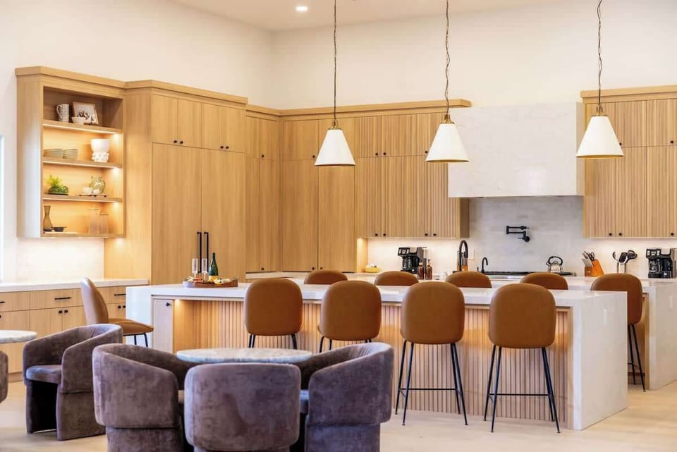Cook with ease in the chef’s kitchen with pro appliances and island seating