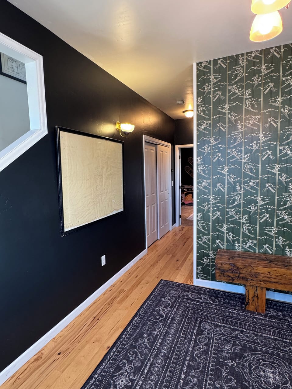 Foyer looking at hall leading to first floor living room 