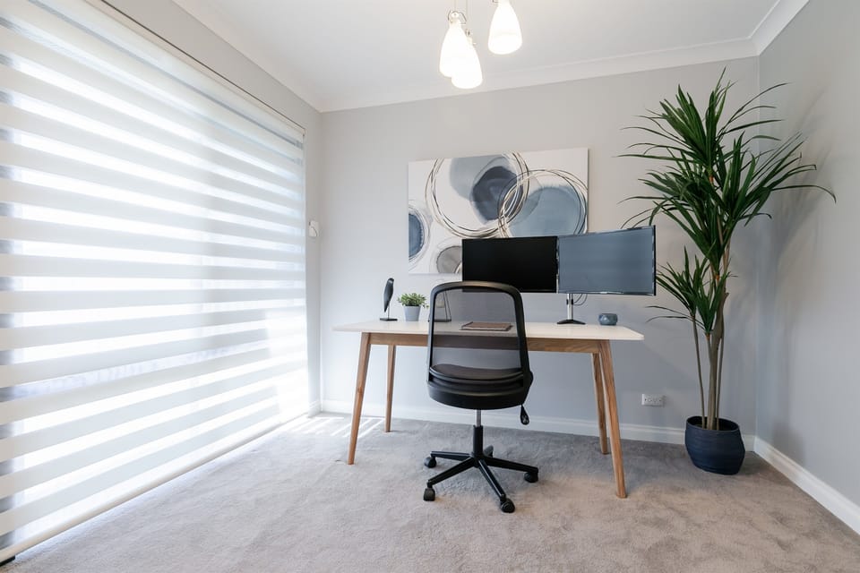 Dedicated workspace with computer monitor in nook of front lounge