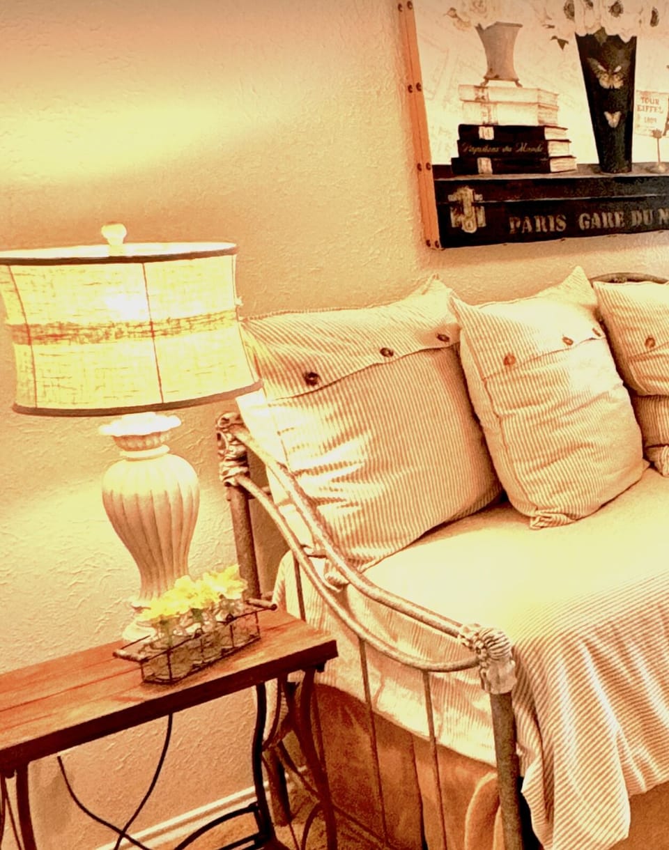 Comfy bed with luxury bedding and lots of pillows.
