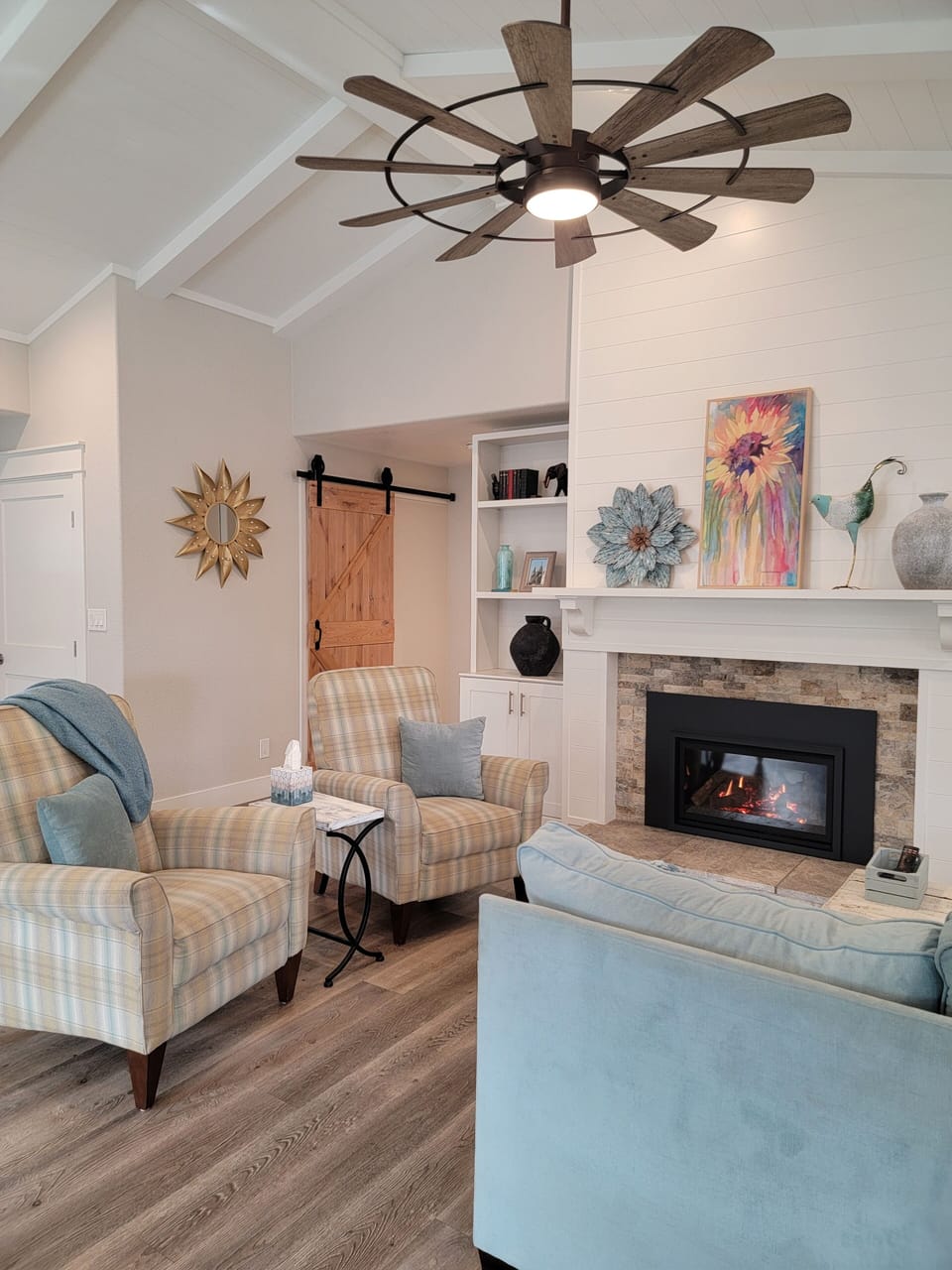 Living room with 2 recliner chairs, sofa and gas fireplace