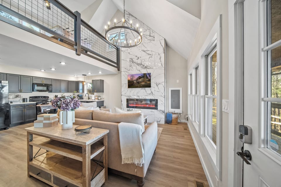 Cozy up in the inviting open living area by the ambiance of a warm fireplace. 