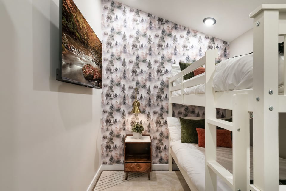 For the little travelers- cozy up in the twin-over-twin bunk room with 50in TV.