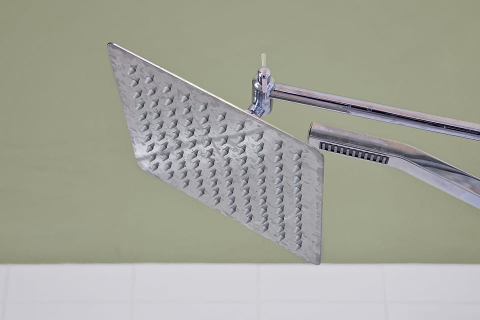 Modern rainfall showerhead for a refreshing start to your vacation mornings.