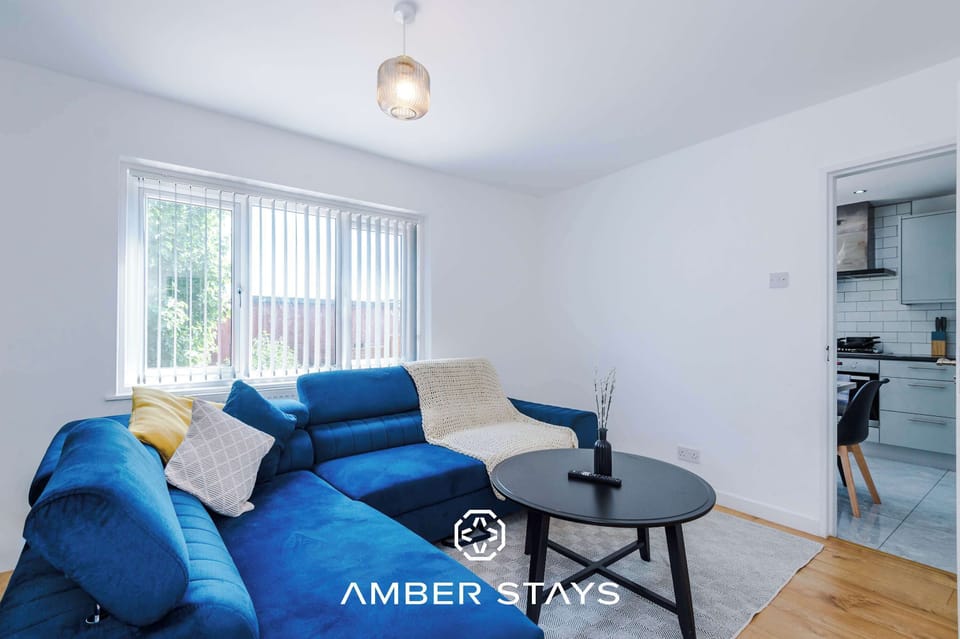 A bright and welcoming living room with comfortable seating, soft lighting, and thoughtful décor. The open layout creates a perfect space for relaxing, entertaining, or enjoying quiet moments
