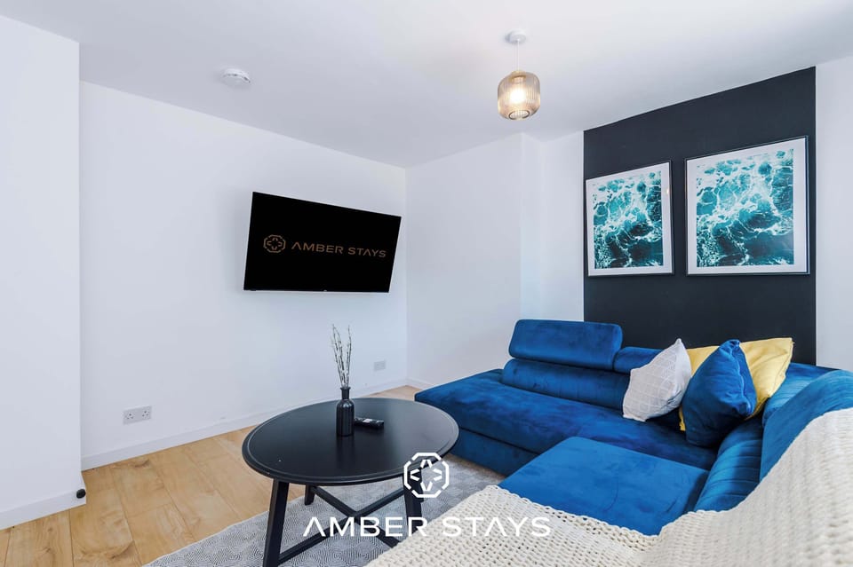 A bright and welcoming living room with comfortable seating, soft lighting, and thoughtful décor. The open layout creates a perfect space for relaxing, entertaining, or enjoying quiet moments