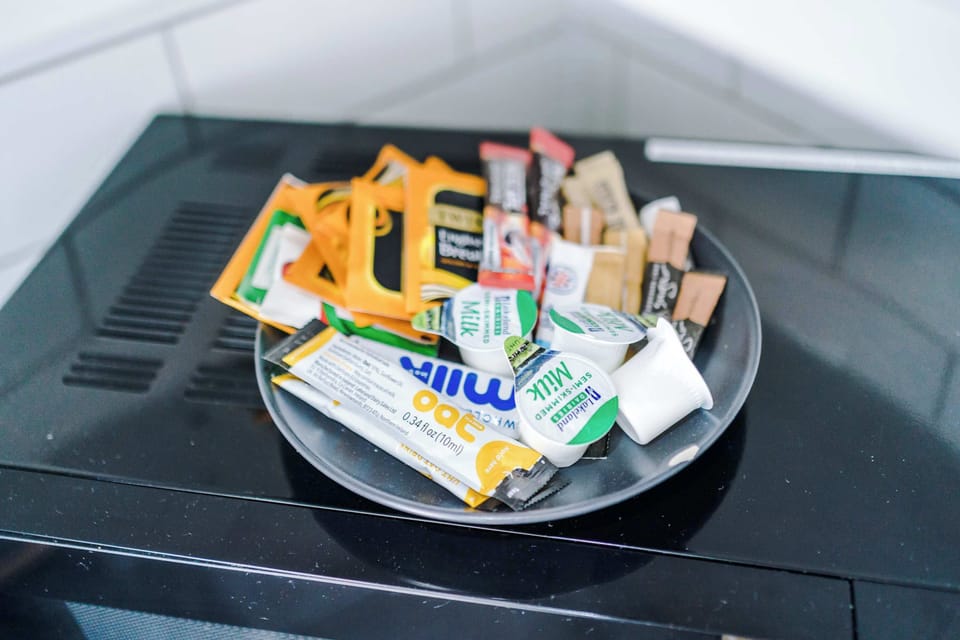 A thoughtful selection of complimentary tea, coffee, and biscuits is provided for guests, demonstrating a commitment to high-quality service.