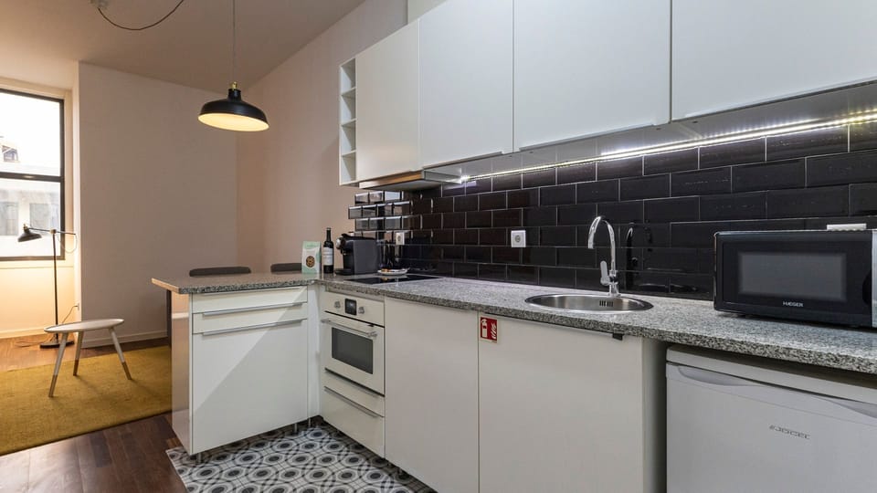 With modern appliances and tasteful design, our kitchenette is the perfect space to cook a delicious snack #practical #colorful