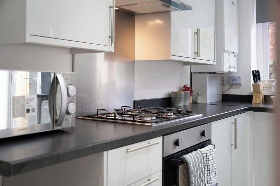 Family-friendly kitchen oasis equipped with all essentials, including a washer & dryer, oven, fridge and full cookware set. Plus, thoughtful touches like children's dinnerware ensure everyone feels right at home in this cozy culinary haven.