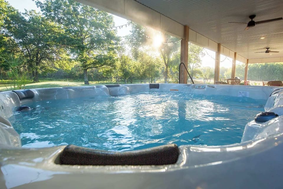 8 person hot tub, 3 steps to get in and out with railing, watch the sunrise or bring your streaming login and watch your favorite shows from this amazing spot on the farm!