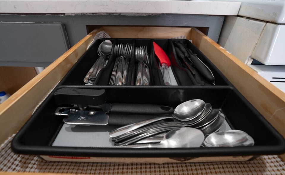 Stocked with cookware, utensils, and prep tools for group cooking.